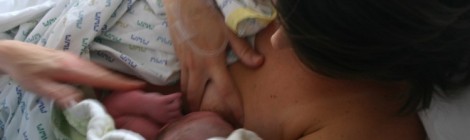 Mother breast feeding new born. Image: Yves Hanoulle